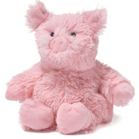 Pink plush pig toy on a white background