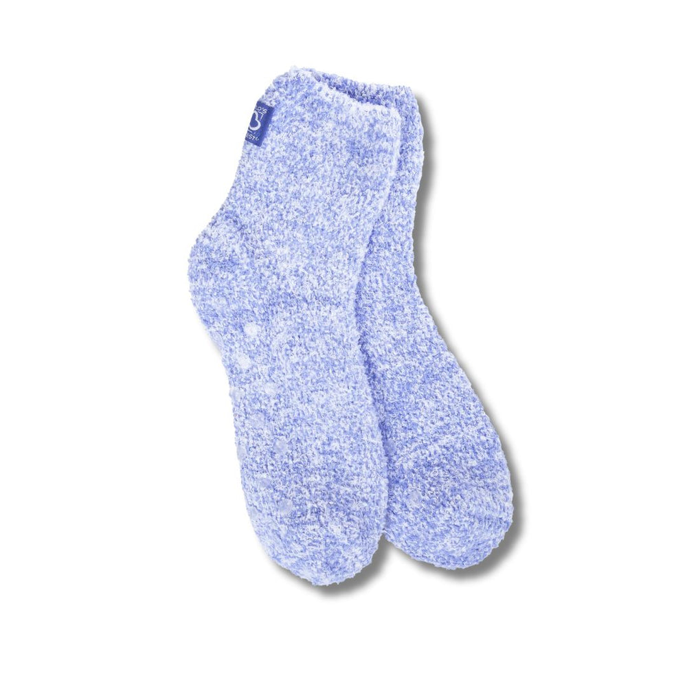 A  pair of blue cozy quarter socks with grippers on the bottom displayed against a white background.