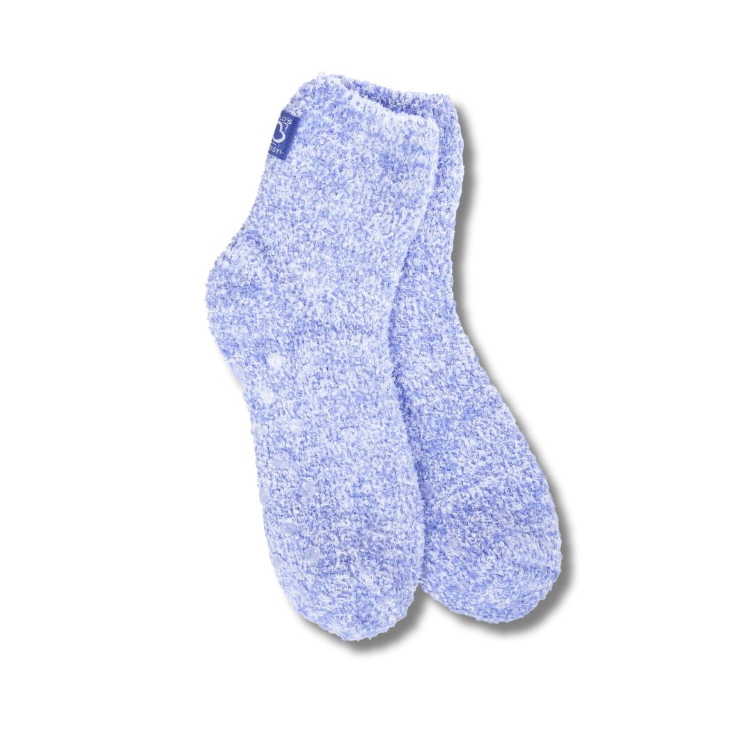 A  pair of blue cozy quarter socks with grippers on the bottom displayed against a white background.