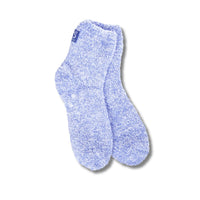 A  pair of blue cozy quarter socks with grippers on the bottom displayed against a white background.