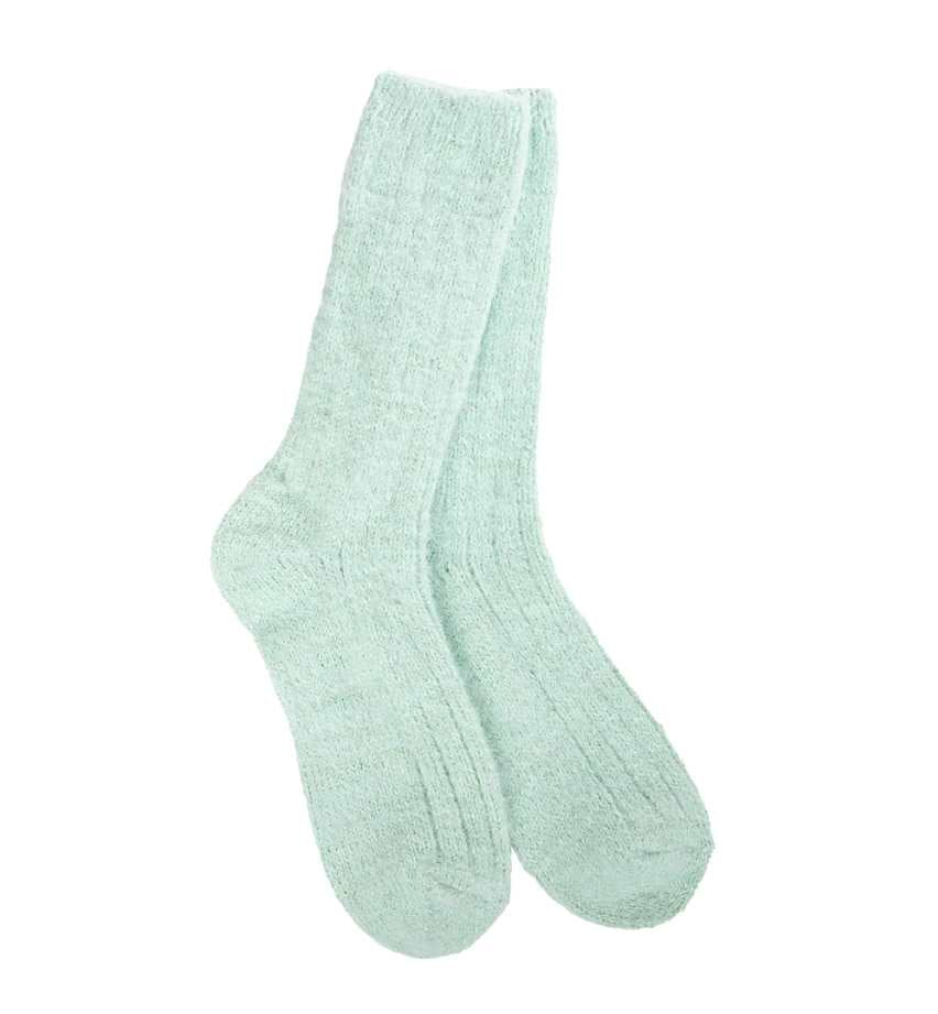 a pair of mint green crew socks with textured surface
