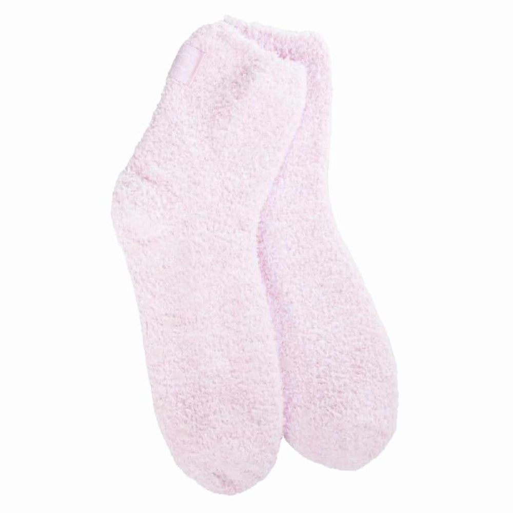 A pair of pink cozy quarter socks with grippers on the bottom displayed against a white background.