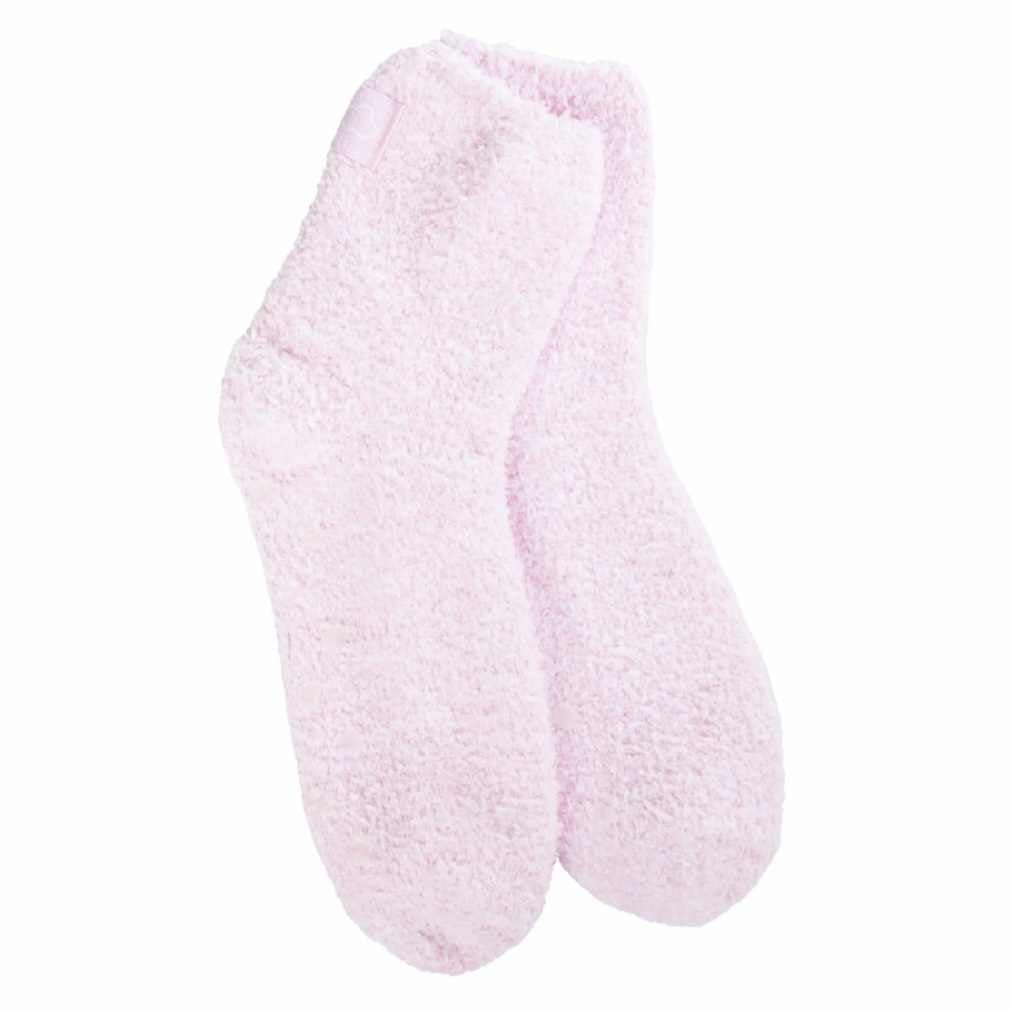 A pair of pink cozy quarter socks with grippers on the bottom displayed against a white background.