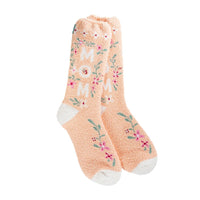 Peach colored socks with pink flowers and green leaves and the word Mom, with white heel and toe area.